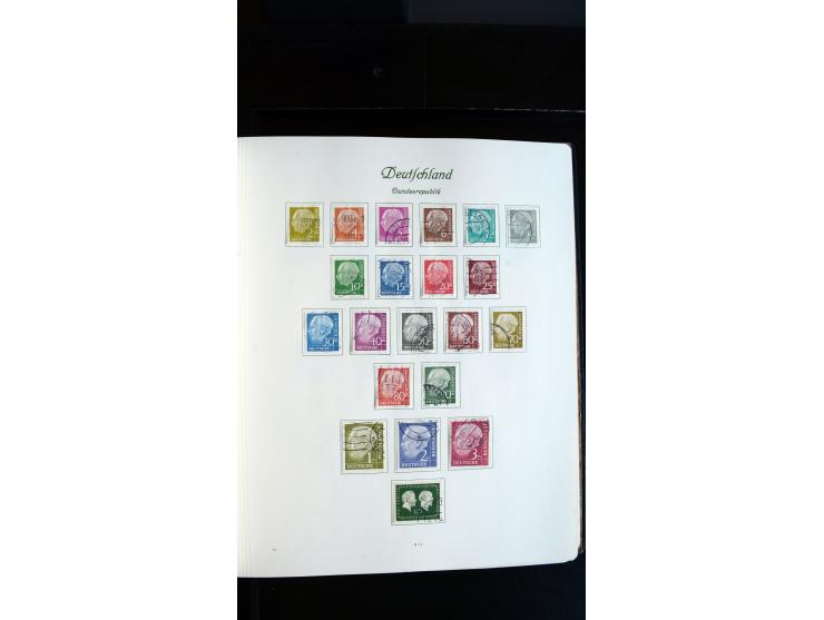 1948/65, gestempelte Sammlungen von Bund, Berlin, DDR und Saarland in zwei Vordruckalben, in den Hauptnummern bis auf Berlin 