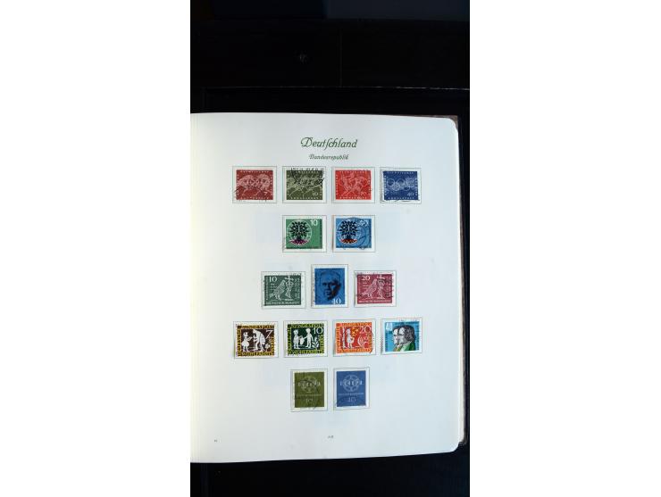 1948/65, gestempelte Sammlungen von Bund, Berlin, DDR und Saarland in zwei Vordruckalben, in den Hauptnummern bis auf Berlin 