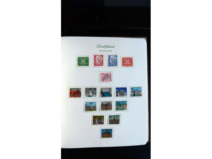 1948/65, gestempelte Sammlungen von Bund, Berlin, DDR und Saarland in zwei Vordruckalben, in den Hauptnummern bis auf Berlin 