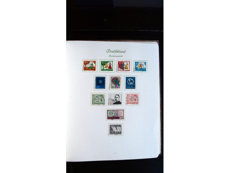1948/65, gestempelte Sammlungen von Bund, Berlin, DDR und Saarland in zwei Vordruckalben, in den Hauptnummern bis auf Berlin 