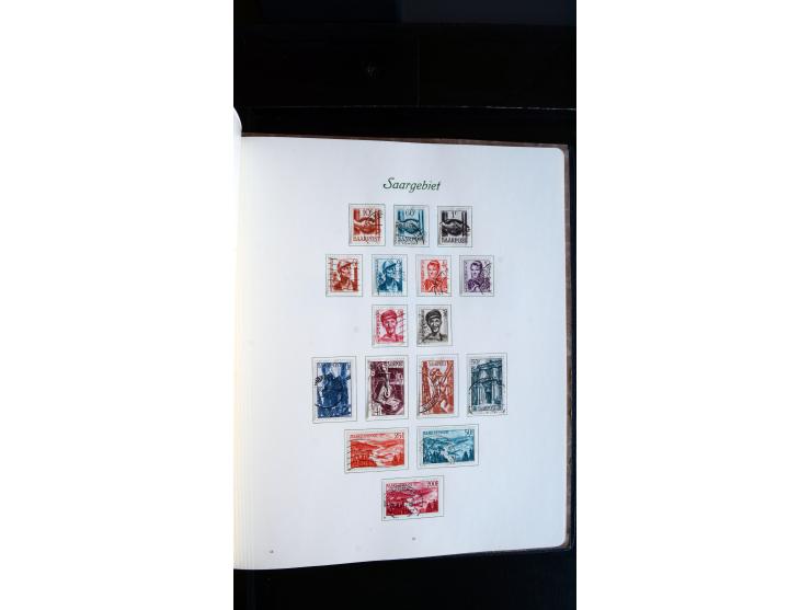 1948/65, gestempelte Sammlungen von Bund, Berlin, DDR und Saarland in zwei Vordruckalben, in den Hauptnummern bis auf Berlin 