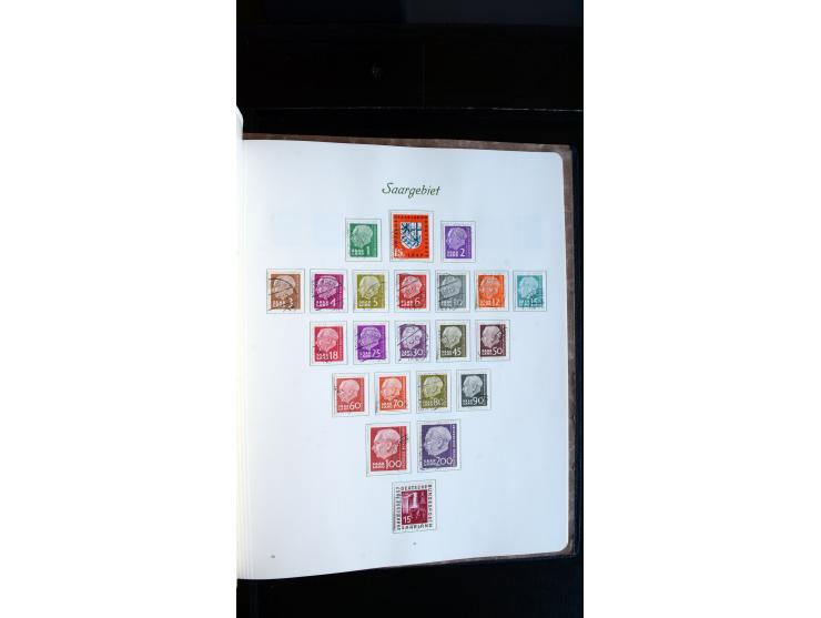 1948/65, gestempelte Sammlungen von Bund, Berlin, DDR und Saarland in zwei Vordruckalben, in den Hauptnummern bis auf Berlin 