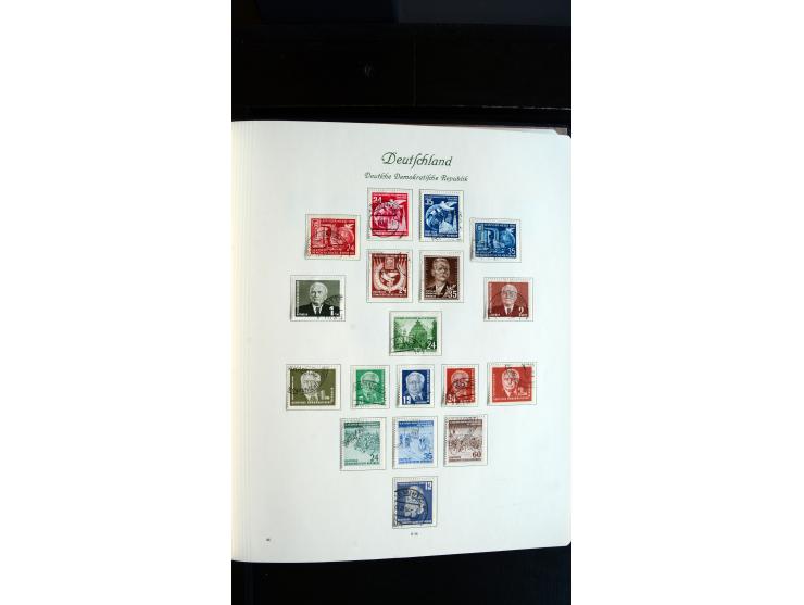 1948/65, gestempelte Sammlungen von Bund, Berlin, DDR und Saarland in zwei Vordruckalben, in den Hauptnummern bis auf Berlin 