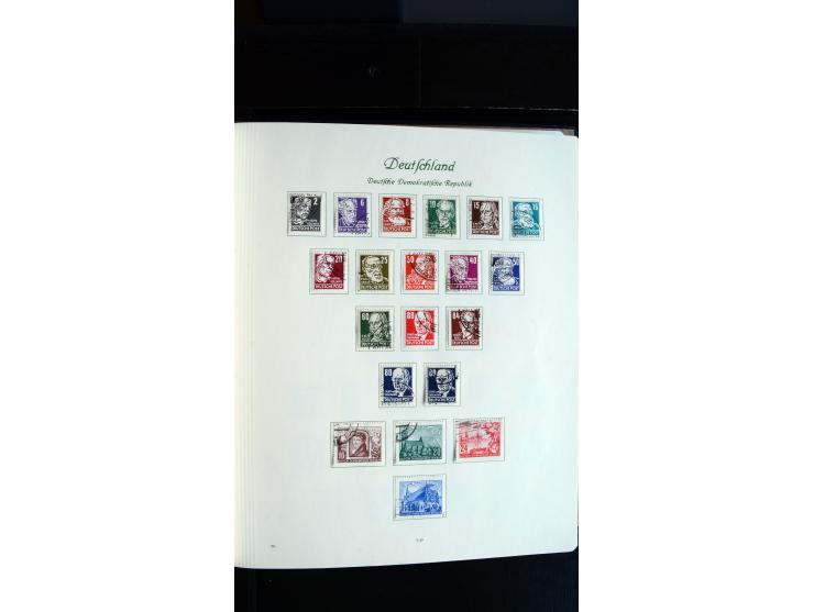 1948/65, gestempelte Sammlungen von Bund, Berlin, DDR und Saarland in zwei Vordruckalben, in den Hauptnummern bis auf Berlin 