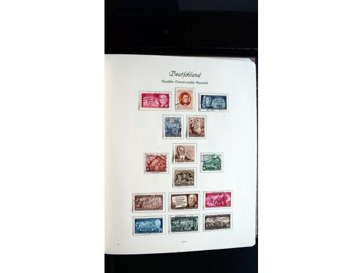 1948/65, gestempelte Sammlungen von Bund, Berlin, DDR und Saarland in zwei Vordruckalben, in den Hauptnummern bis auf Berlin 