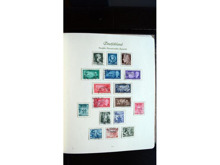 1948/65, gestempelte Sammlungen von Bund, Berlin, DDR und Saarland in zwei Vordruckalben, in den Hauptnummern bis auf Berlin 