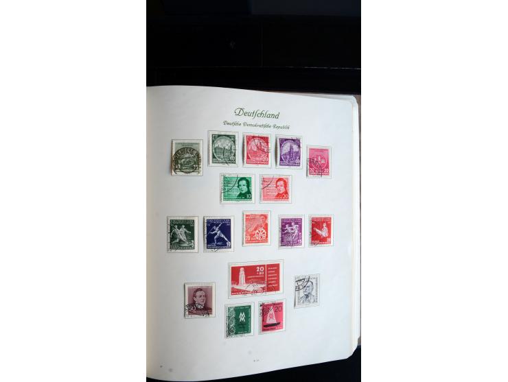 1948/65, gestempelte Sammlungen von Bund, Berlin, DDR und Saarland in zwei Vordruckalben, in den Hauptnummern bis auf Berlin 