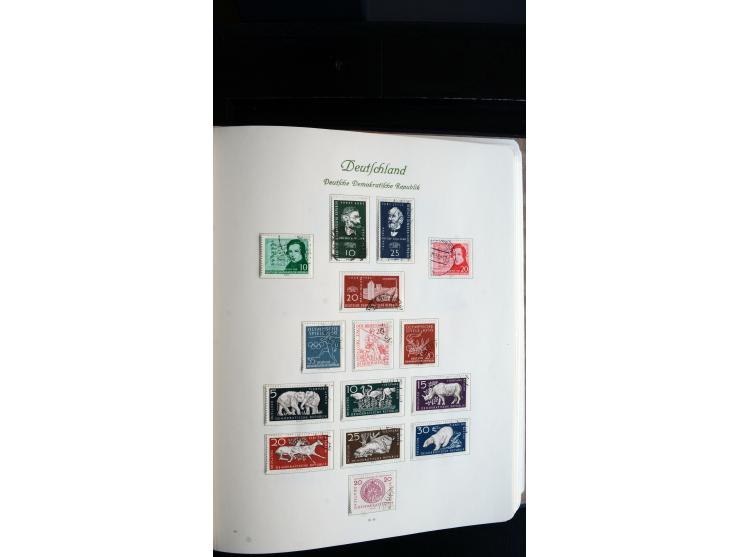 1948/65, gestempelte Sammlungen von Bund, Berlin, DDR und Saarland in zwei Vordruckalben, in den Hauptnummern bis auf Berlin 