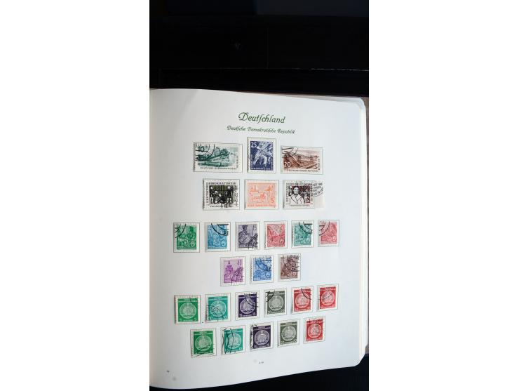 1948/65, gestempelte Sammlungen von Bund, Berlin, DDR und Saarland in zwei Vordruckalben, in den Hauptnummern bis auf Berlin 