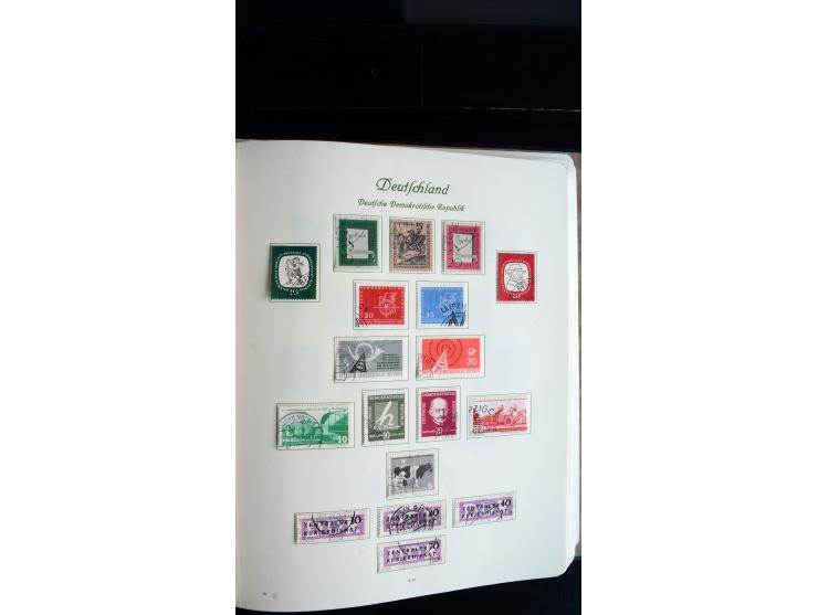 1948/65, gestempelte Sammlungen von Bund, Berlin, DDR und Saarland in zwei Vordruckalben, in den Hauptnummern bis auf Berlin 