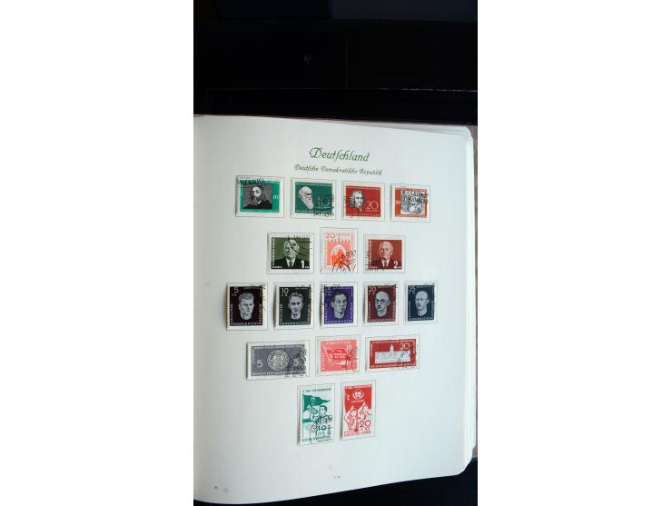 1948/65, gestempelte Sammlungen von Bund, Berlin, DDR und Saarland in zwei Vordruckalben, in den Hauptnummern bis auf Berlin 