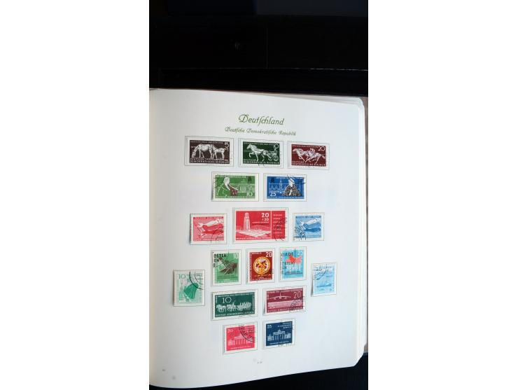 1948/65, gestempelte Sammlungen von Bund, Berlin, DDR und Saarland in zwei Vordruckalben, in den Hauptnummern bis auf Berlin 