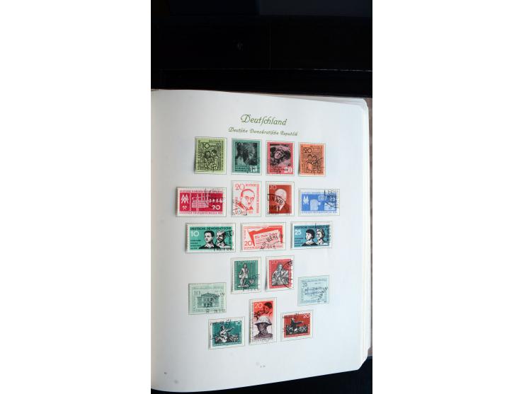 1948/65, gestempelte Sammlungen von Bund, Berlin, DDR und Saarland in zwei Vordruckalben, in den Hauptnummern bis auf Berlin 