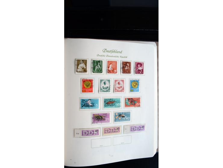 1948/65, gestempelte Sammlungen von Bund, Berlin, DDR und Saarland in zwei Vordruckalben, in den Hauptnummern bis auf Berlin 