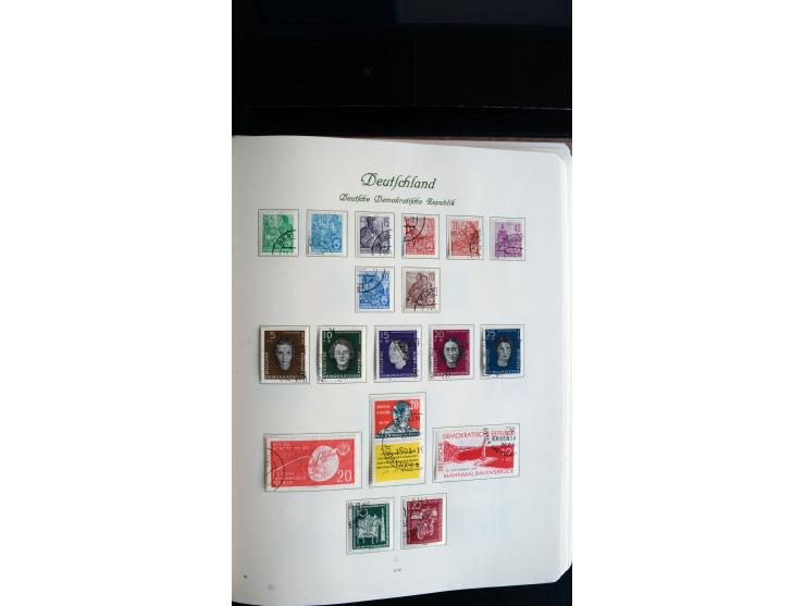 1948/65, gestempelte Sammlungen von Bund, Berlin, DDR und Saarland in zwei Vordruckalben, in den Hauptnummern bis auf Berlin 