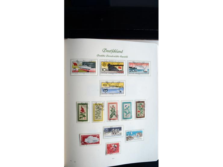 1948/65, gestempelte Sammlungen von Bund, Berlin, DDR und Saarland in zwei Vordruckalben, in den Hauptnummern bis auf Berlin 