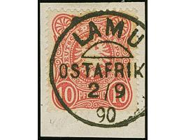10 Pfennig dunkelrosarot mit zentrischem Stempel "LAMU 2/9 90" auf Briefstück. Signiert v. Willmann.