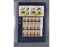 1960/2004, Stamps in blocks, all mint never hinged, including complete sheet animals 1979, 43 souvenir sheets, very fine.