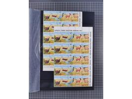 1960/2004, Stamps in blocks, all mint never hinged, including complete sheet animals 1979, 43 souvenir sheets, very fine.