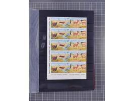 1960/2004, Stamps in blocks, all mint never hinged, including complete sheet animals 1979, 43 souvenir sheets, very fine.