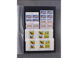 1960/2004, Stamps in blocks, all mint never hinged, including complete sheet animals 1979, 43 souvenir sheets, very fine.